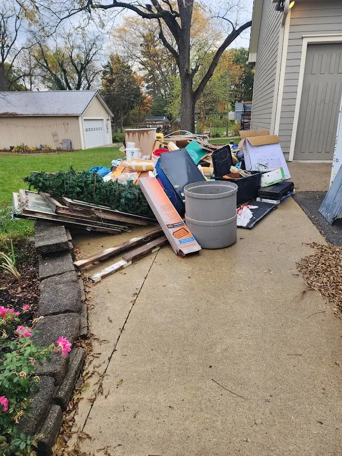 Dumpster being loaded with debris for Commercial Dumpster Rental in Chesapeake